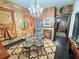 Eclectic dining room featuring a glass table, unique wall textures, and statement lighting at 23 Gould Se St, Atlanta, GA 30315