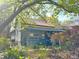 Cozy home exterior featuring a covered porch, lush greenery, and a tranquil garden setting at 23 Gould Se St, Atlanta, GA 30315