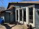 Exterior shot of a blue house featuring wood deck, double glass doors, and custom lighting at 23 Gould Se St, Atlanta, GA 30315