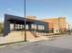 Contemporary commercial building with accessible ramp and well-lit facade for easy access at 23 Gould Se St, Atlanta, GA 30315