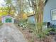 View of the exterior of the garage with mural and landscaping at 23 Gould Se St, Atlanta, GA 30315