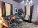 Elegant living room with stylish decor, chandelier lighting, and hardwood floors, offering a cozy atmosphere at 23 Gould Se St, Atlanta, GA 30315