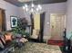 Elegant living room featuring hardwood floors, stylish chandelier, and comfortable seating, perfect for relaxation at 23 Gould Se St, Atlanta, GA 30315