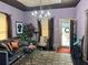 Elegant living room with hardwood floors, stylish chandelier, and comfortable seating, creating a cozy ambiance at 23 Gould Se St, Atlanta, GA 30315