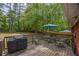 Inviting wooden deck with grill, dining table, and seating at 3761 Lindley Cir, Powder Springs, GA 30127