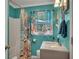 Bathroom with a seashell-themed shower curtain and blue walls at 3761 Lindley Cir, Powder Springs, GA 30127