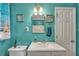 Bathroom featuring blue walls, vanity, medicine cabinet and a sleek toilet at 3761 Lindley Cir, Powder Springs, GA 30127