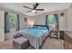 Cozy bedroom featuring neutral walls, carpeted floors, and a ceiling fan for added comfort at 3761 Lindley Cir, Powder Springs, GA 30127