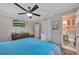 Cozy bedroom featuring ceiling fan, television, and neutral paint scheme at 3761 Lindley Cir, Powder Springs, GA 30127