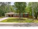 Charming brick ranch home with a lush front lawn and a covered carport at 3761 Lindley Cir, Powder Springs, GA 30127