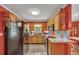 Well-lit kitchen boasts wooden cabinetry, modern appliances, and granite countertops perfect for cooking at 3761 Lindley Cir, Powder Springs, GA 30127