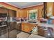 Spacious kitchen equipped with stainless steel appliances and a window view at 3761 Lindley Cir, Powder Springs, GA 30127