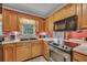 Functional kitchen with stainless steel appliances, ample counter space, and wooden cabinets at 3761 Lindley Cir, Powder Springs, GA 30127