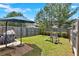 Backyard with wooden fence, playset, lawn, and shade at 635 Oakside Pl, Acworth, GA 30102