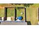 Aerial backyard view with privacy fence, grass, and outdoor furniture at 635 Oakside Pl, Acworth, GA 30102
