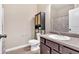 Neutral bathroom features a single vanity with a sink and a toilet with shelving at 635 Oakside Pl, Acworth, GA 30102