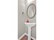 Bathroom featuring a pedestal sink with an oval mirror, and tile flooring at 635 Oakside Pl, Acworth, GA 30102