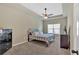 Comfortable bedroom with a tray ceiling, ceiling fan, and lots of natural light at 635 Oakside Pl, Acworth, GA 30102