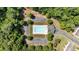 Aerial view of a community pool surrounded by lush trees with ample parking at 635 Oakside Pl, Acworth, GA 30102