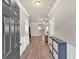 Inviting entryway featuring hardwood floors, neutral paint, and a modern storage cabinet at 635 Oakside Pl, Acworth, GA 30102