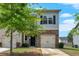 Charming two-story home with stone accents, a single-car garage, and a neatly maintained front yard at 635 Oakside Pl, Acworth, GA 30102