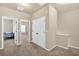 Hallway with carpet, doorways, and a double-door closet at 635 Oakside Pl, Acworth, GA 30102