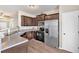 Kitchen with stainless steel appliances, dark cabinets, and light countertops at 635 Oakside Pl, Acworth, GA 30102