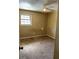 Neutral bedroom with a window and beige carpet at 6354 Shannon Pkwy # 13C, Union City, GA 30291
