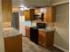 Kitchen features a black electric stove, microwave, and refrigerator at 6354 Shannon Pkwy # 13C, Union City, GA 30291