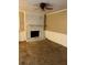 Living room featuring a painted fireplace and ceiling fan at 6354 Shannon Pkwy # 13C, Union City, GA 30291