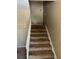 Carpeted stairway with white railings at 6354 Shannon Pkwy # 13C, Union City, GA 30291