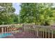 Inviting back deck offers scenic views of the pool and backyard at 1300 Sever Woods Dr, Lawrenceville, GA 30043