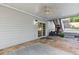 Stone back patio with ceiling fan and sliding glass door at 1300 Sever Woods Dr, Lawrenceville, GA 30043