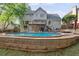 The backyard is well maintained and features an in-ground pool at 1300 Sever Woods Dr, Lawrenceville, GA 30043