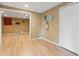 Finished basement features laminate wood floors, a suspended ceiling, and access to another room at 1300 Sever Woods Dr, Lawrenceville, GA 30043