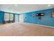 Finished basement featuring blue walls, neutral carpet, and a door to the outside at 1300 Sever Woods Dr, Lawrenceville, GA 30043