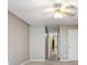 Bedroom featuring neutral paint, carpet, a ceiling fan, and a hallway entrance at 1300 Sever Woods Dr, Lawrenceville, GA 30043