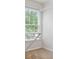 Bedroom walk-in closet with rack, shelving and a window with natural light at 1300 Sever Woods Dr, Lawrenceville, GA 30043