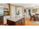 Dining area boasts wood floors, a stylish light fixture, and natural light from the windows at 1300 Sever Woods Dr, Lawrenceville, GA 30043