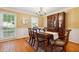 Elegant dining room with hardwood floors, wainscoting, and a large window providing natural light at 1300 Sever Woods Dr, Lawrenceville, GA 30043