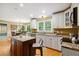 Spacious kitchen with custom cabinets, stainless steel appliances, and a granite island at 1300 Sever Woods Dr, Lawrenceville, GA 30043