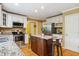 Kitchen features an island with seating, stainless appliances, and lots of cabinet space at 1300 Sever Woods Dr, Lawrenceville, GA 30043