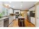 Well-equipped kitchen with ample storage, stainless appliances, and a functional center island at 1300 Sever Woods Dr, Lawrenceville, GA 30043