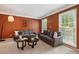 Cozy living room with neutral carpet, fresh paint, two sofas, and large windows providing natural light at 1300 Sever Woods Dr, Lawrenceville, GA 30043