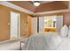 View of main bedroom leading into bathroom and closet, neutral paint, tray ceiling at 1300 Sever Woods Dr, Lawrenceville, GA 30043