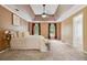 Large main bedroom featuring a tray ceiling, neutral paint and lots of natural light at 1300 Sever Woods Dr, Lawrenceville, GA 30043