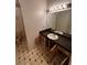 Bathroom with a single sink vanity and large mirror at 1504 Colt Ridge Se Ln, Mableton, GA 30126