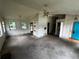 Living room with large windows, a fan, and a door leading outside at 1504 Colt Ridge Se Ln, Mableton, GA 30126