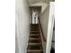 A carpeted stairwell leading to the second story at 1504 Colt Ridge Se Ln, Mableton, GA 30126
