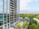 High-rise building featuring an outdoor pool, tennis court, and beautiful views of the surrounding greenery at 2795 Peachtree Ne Rd # 2101, Atlanta, GA 30305